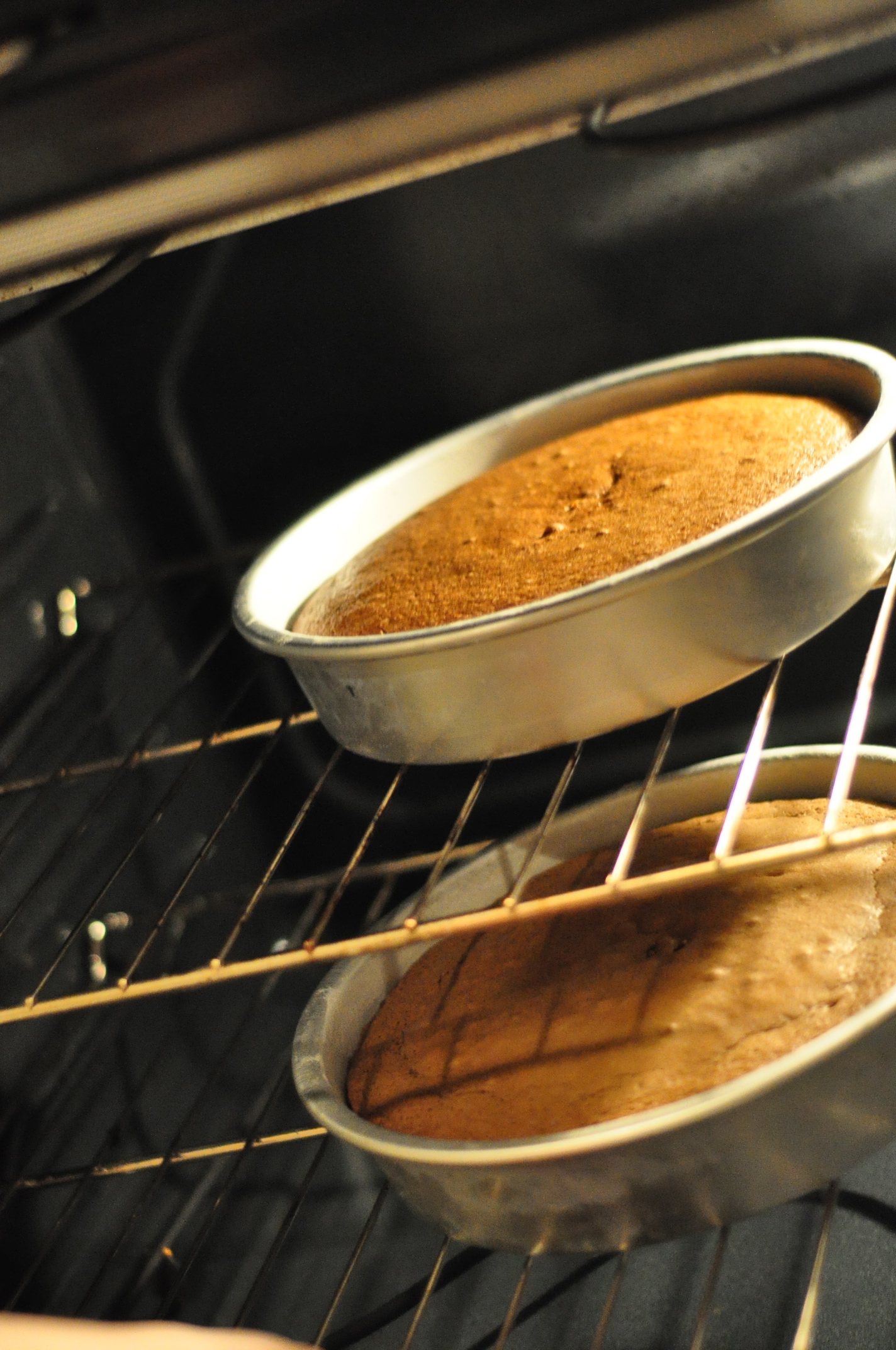 Cakes coming out of oven Cakes coming out of oven